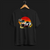 Front of Racing Sport Rally Sunset Automotive Graphic T-Shirt – Black unisex tee featuring a rally car and a vintage car against a bold sunset background in shades of red, orange, and yellow. Ideal gift for car and motorsport enthusiasts.