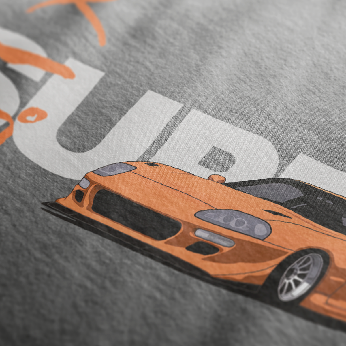 Close Up of FF Supra Buster Automotive Graphic T-Shirt Design – Charcoal unisex tee featuring an orange Toyota Supra with Japanese text and a grey 'SUPRA' background. Ideal gift for JDM fans and car enthusiasts.