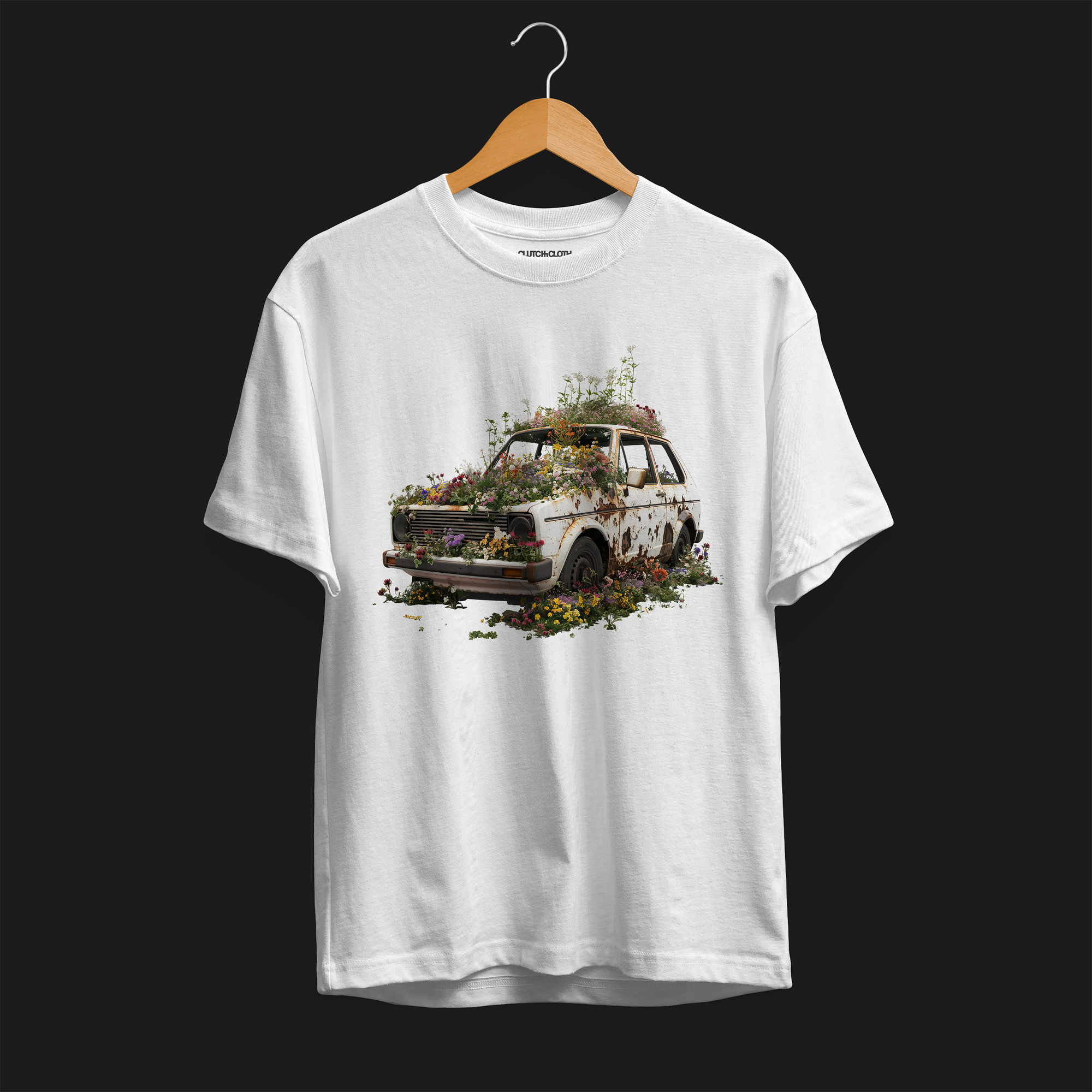 Front angle of Volks Retro Life Automotive Graphic T-Shirt – White unisex tee featuring a vintage rusted car overgrown with flowers. A unique gift for car enthusiasts and retro automotive lovers.