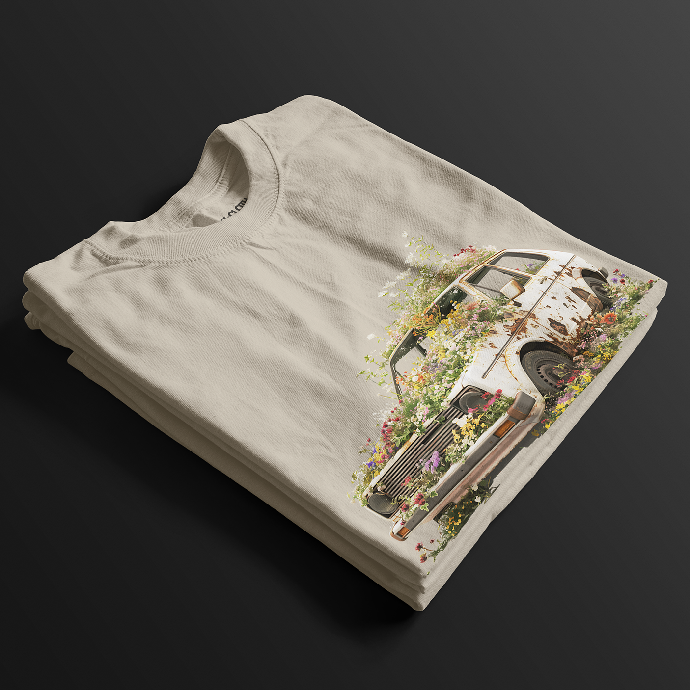 Folded Volks Retro Life Automotive Graphic T-Shirt – Sand unisex tee featuring a vintage rusted car overgrown with flowers. A unique gift for car enthusiasts and retro automotive lovers.